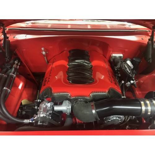 LS engine with carbon fiber covers in a red engine bay